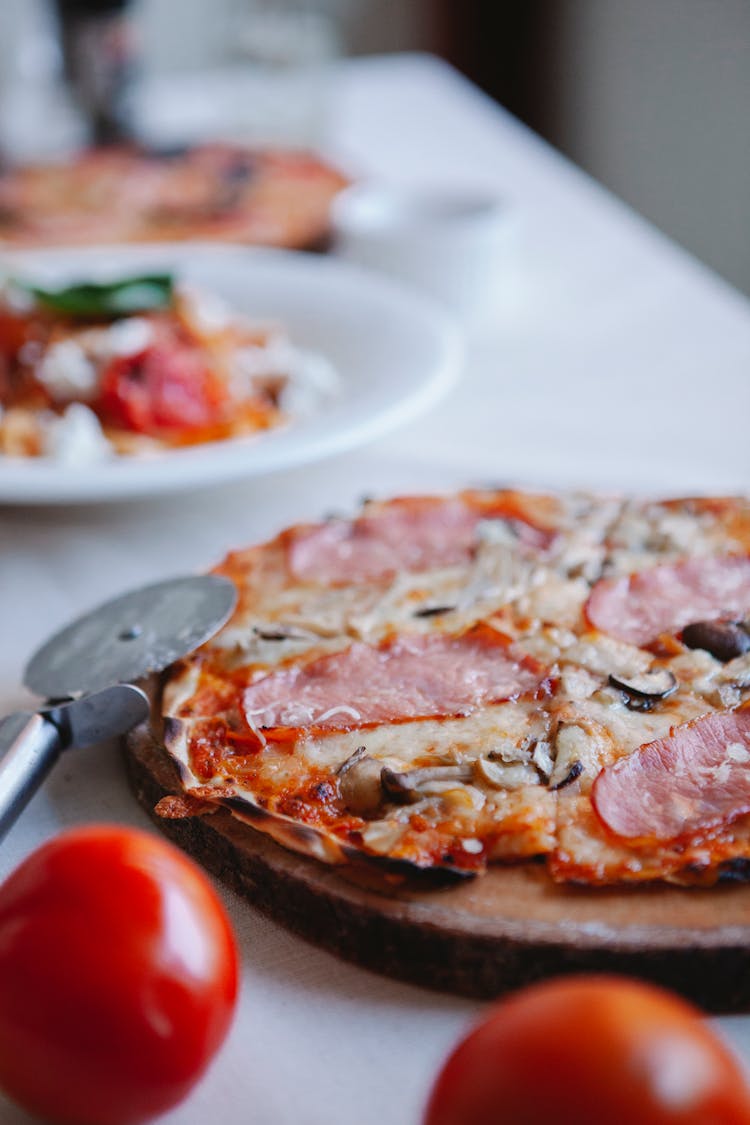 Pizza On Round Wooden Board