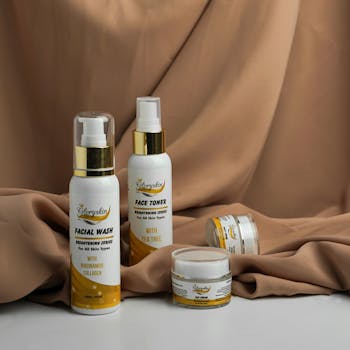 Stylized photo of Gloryskin skincare products in a beige aesthetic setting.