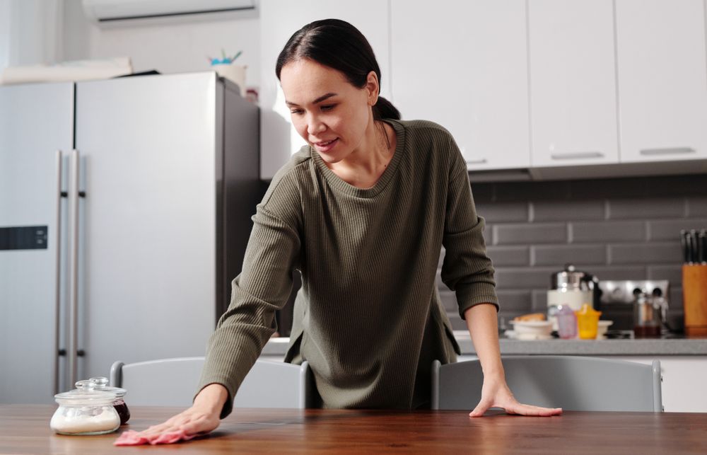 Wiping a table as part of an everyday home routine