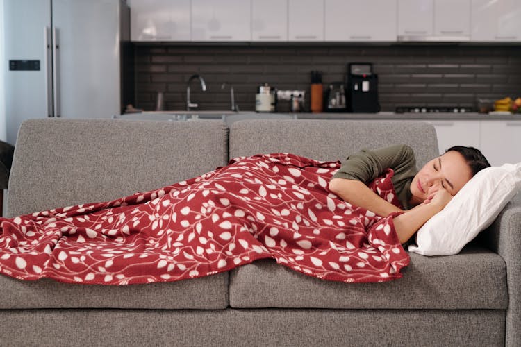 Woman Sleeping On Sofa