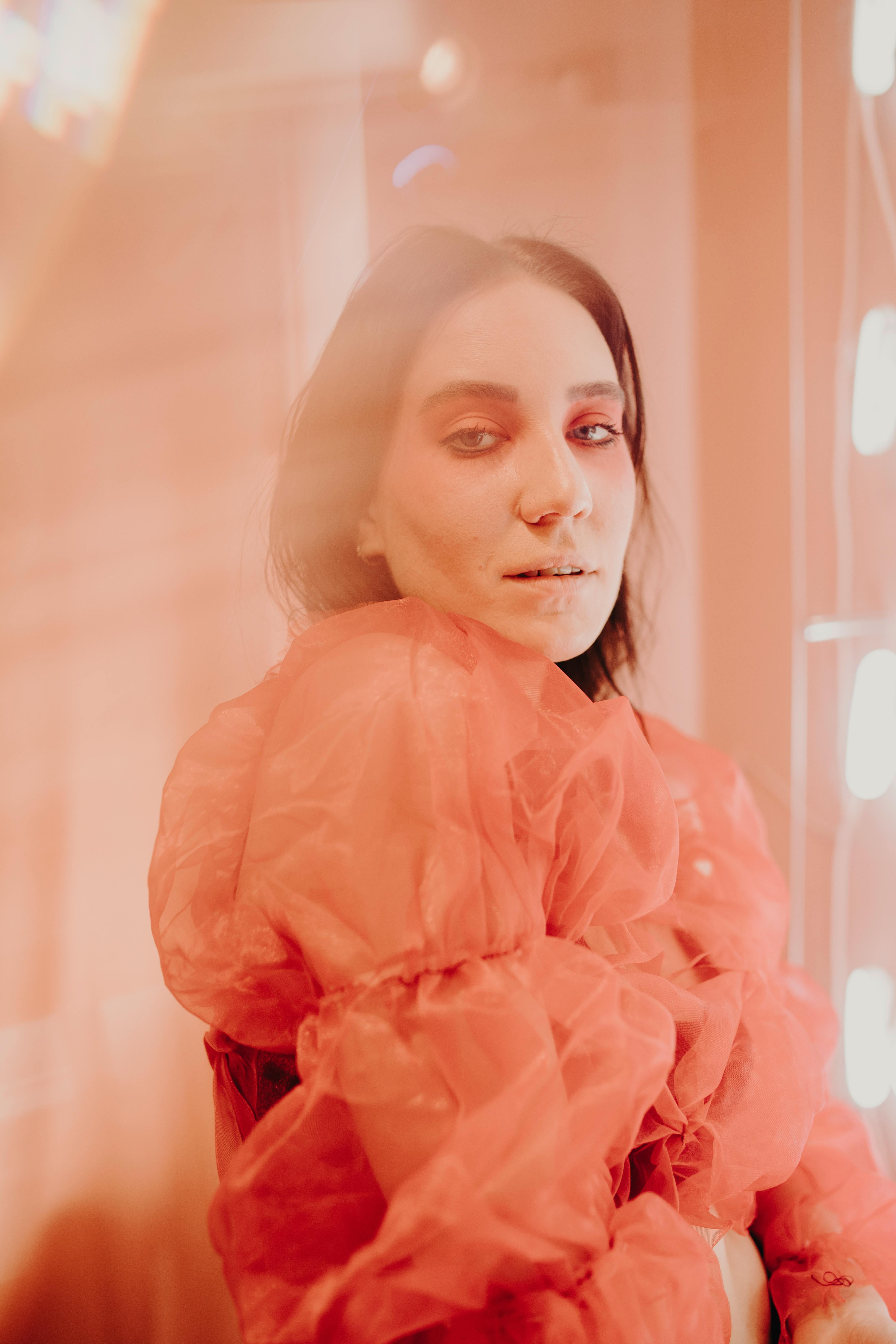 woman in orange dress shirt