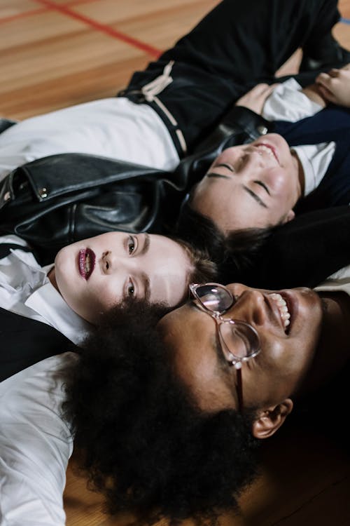 Free Group of Teenagers Lying in a Circle Stock Photo