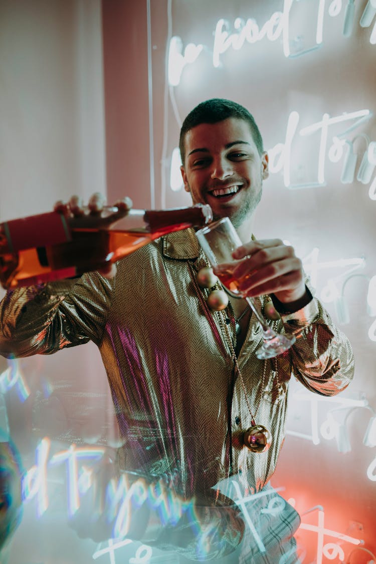 Man Pouring Wine Into Glass