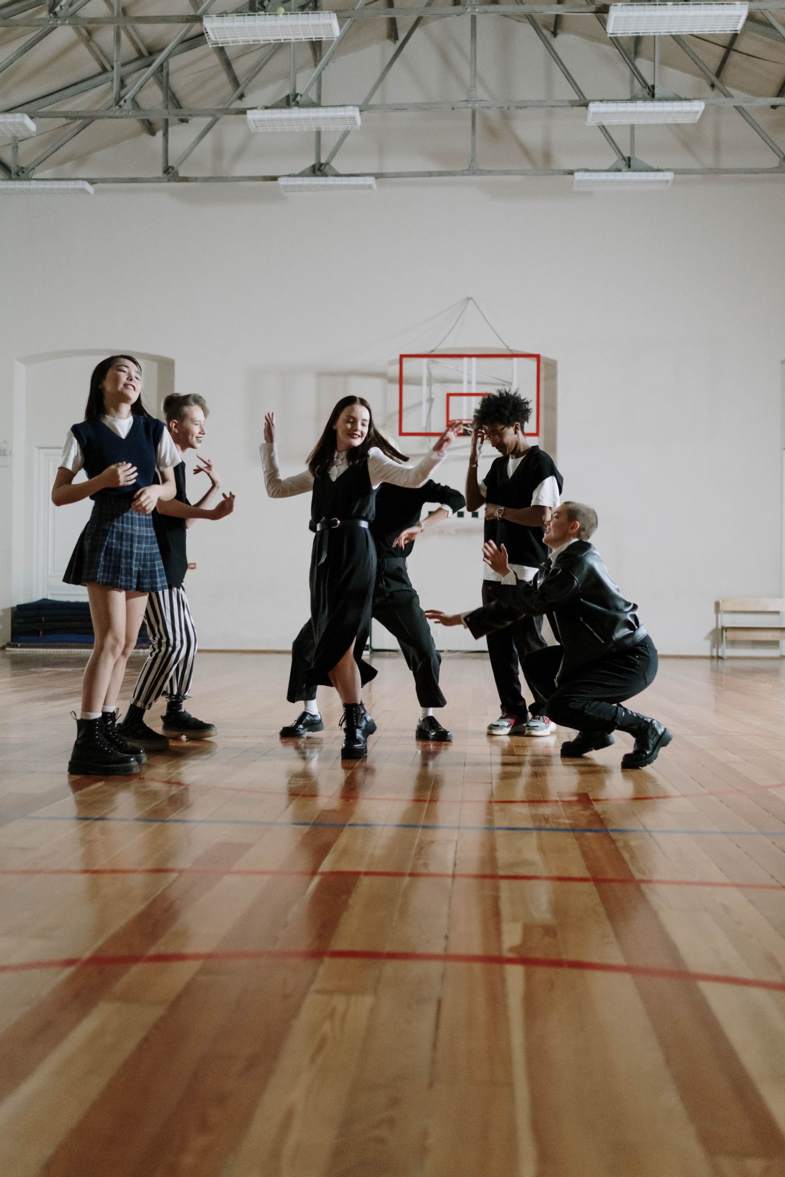 Students learning group choreography in class