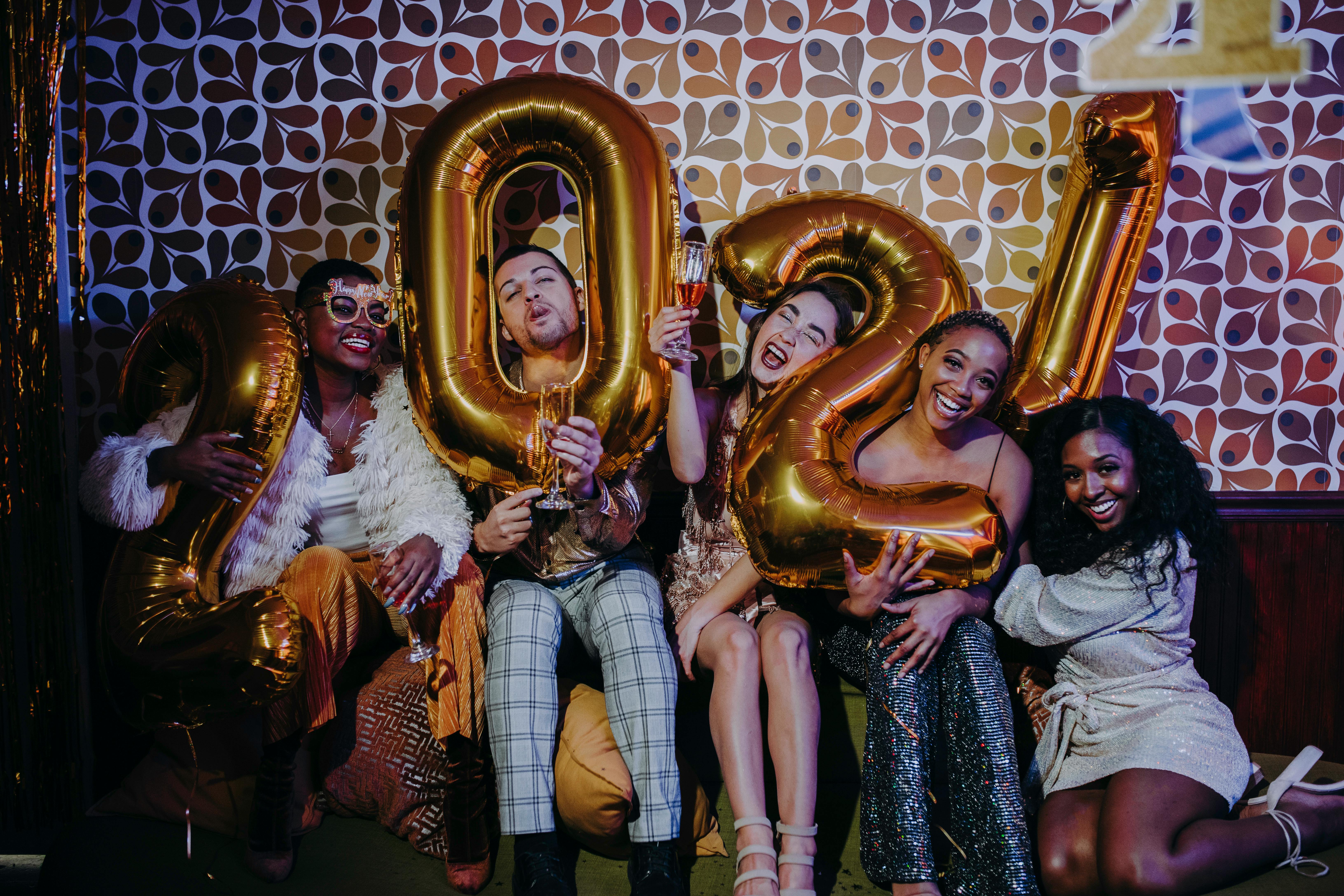 people holding balloon at a party