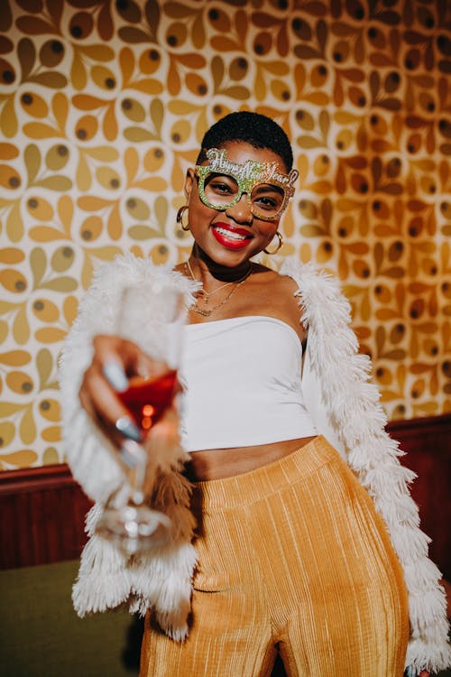 Woman in White Crop Top Holding Champagne Glass