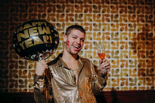 Man Holding Champagne Glass and a Balloon