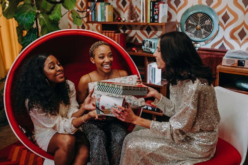 A Group of Friends Giving Gifts 