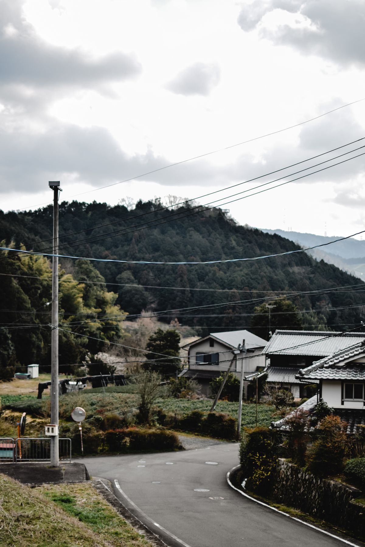 Scenic village road in Wazuka, Kyoto, Japan surrounded by lush hills