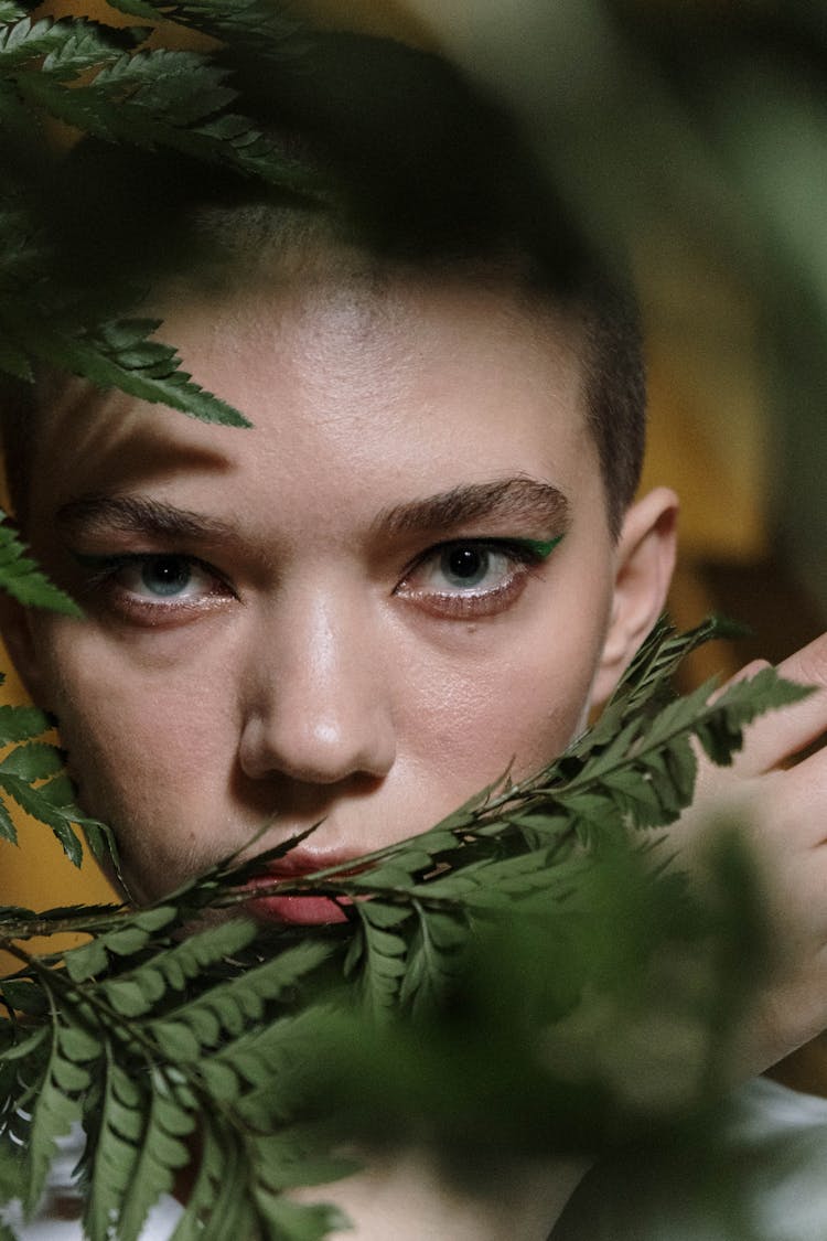 Green Leaves Near The Woman's Face 