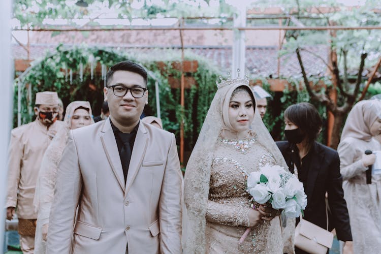 Hijabi Bride And Groom Walking Down Aisle