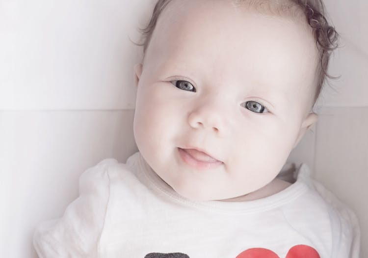 Baby Wearing White Red And Black T Shirt