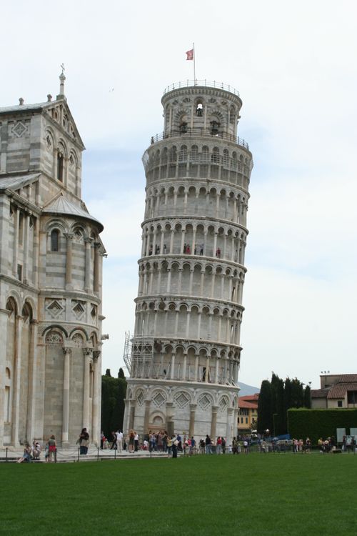 Free Leaning Tower of Pisa, a famous architectural landmark in Italy, with tourists. Stock Photo