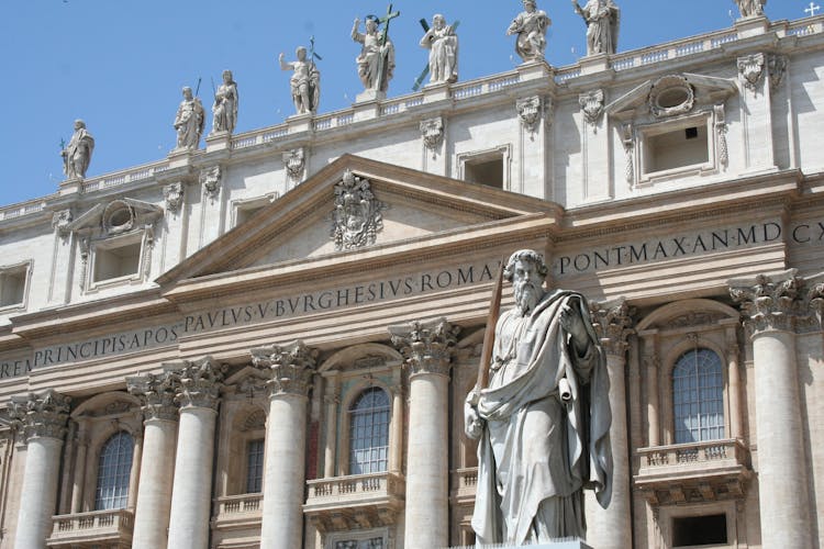 Shot Of A White Classical Architecture With Script And Statues