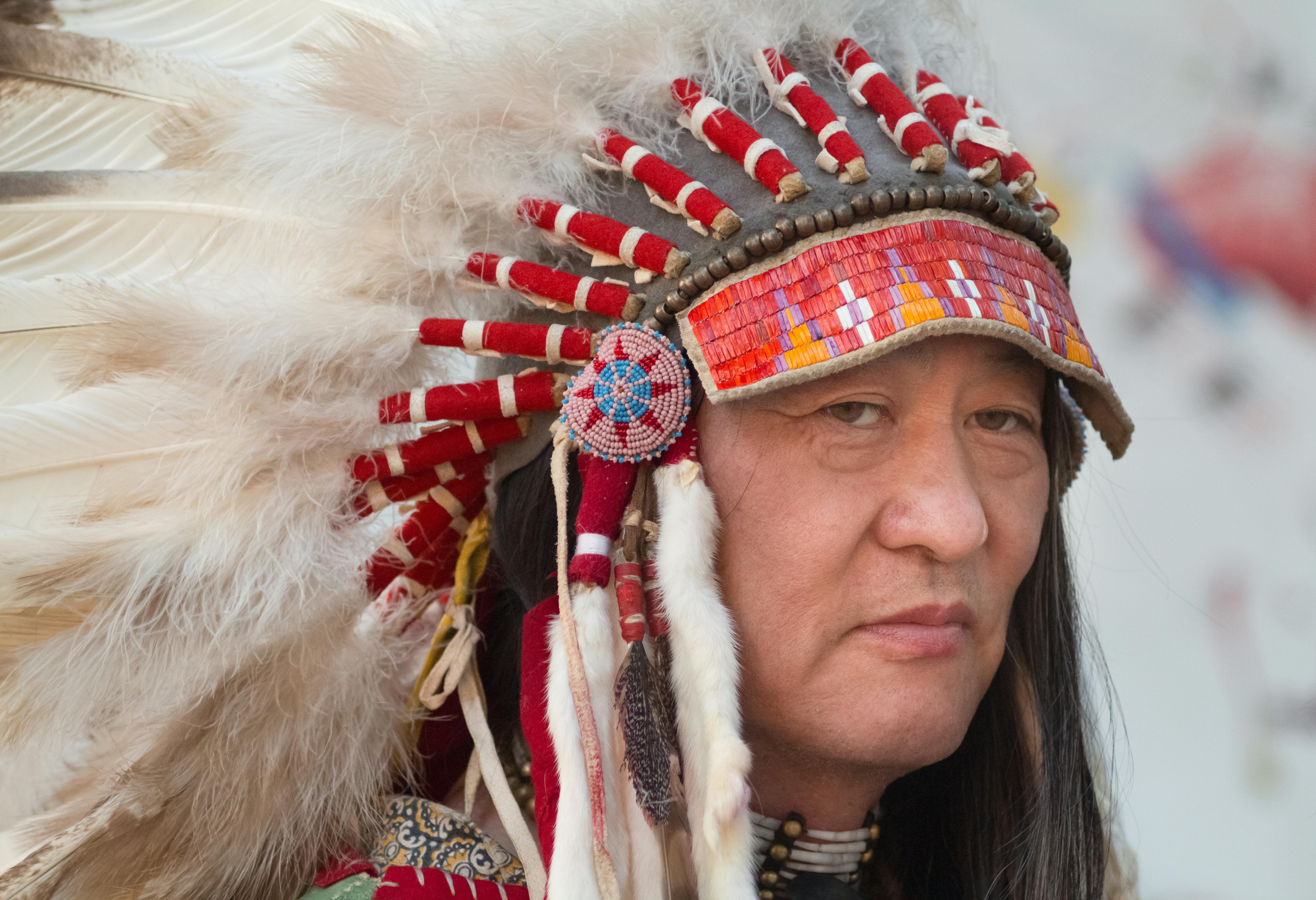 man wearing a feather headdress