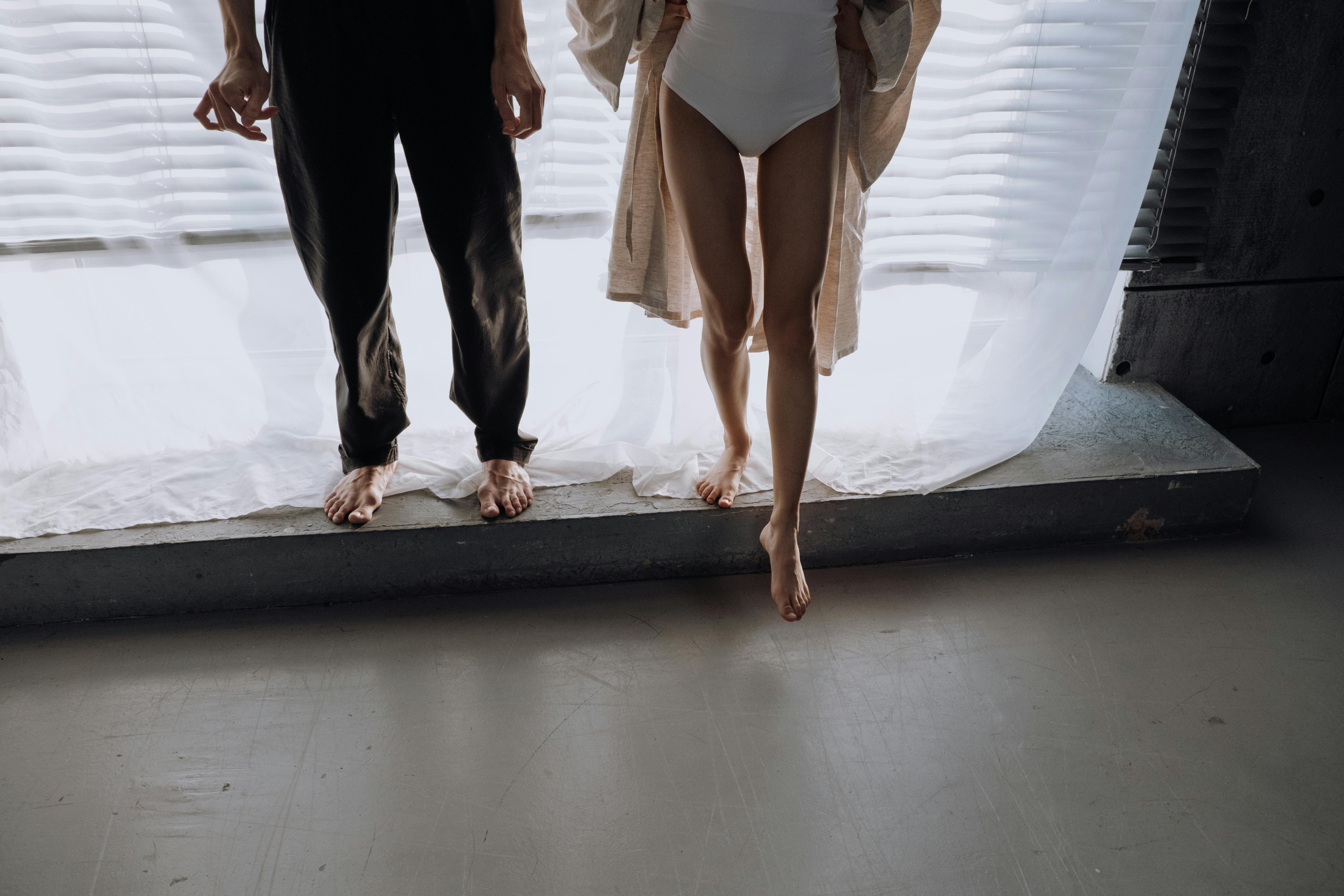 Woman rushed to hospital after 'plunging from flat window' as man in his 40s arrested on suspicion of assault