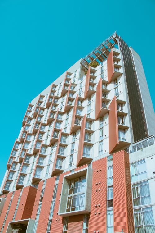 Free Stylish and contemporary apartment building exterior in San Diego, featuring unique facade design. Stock Photo