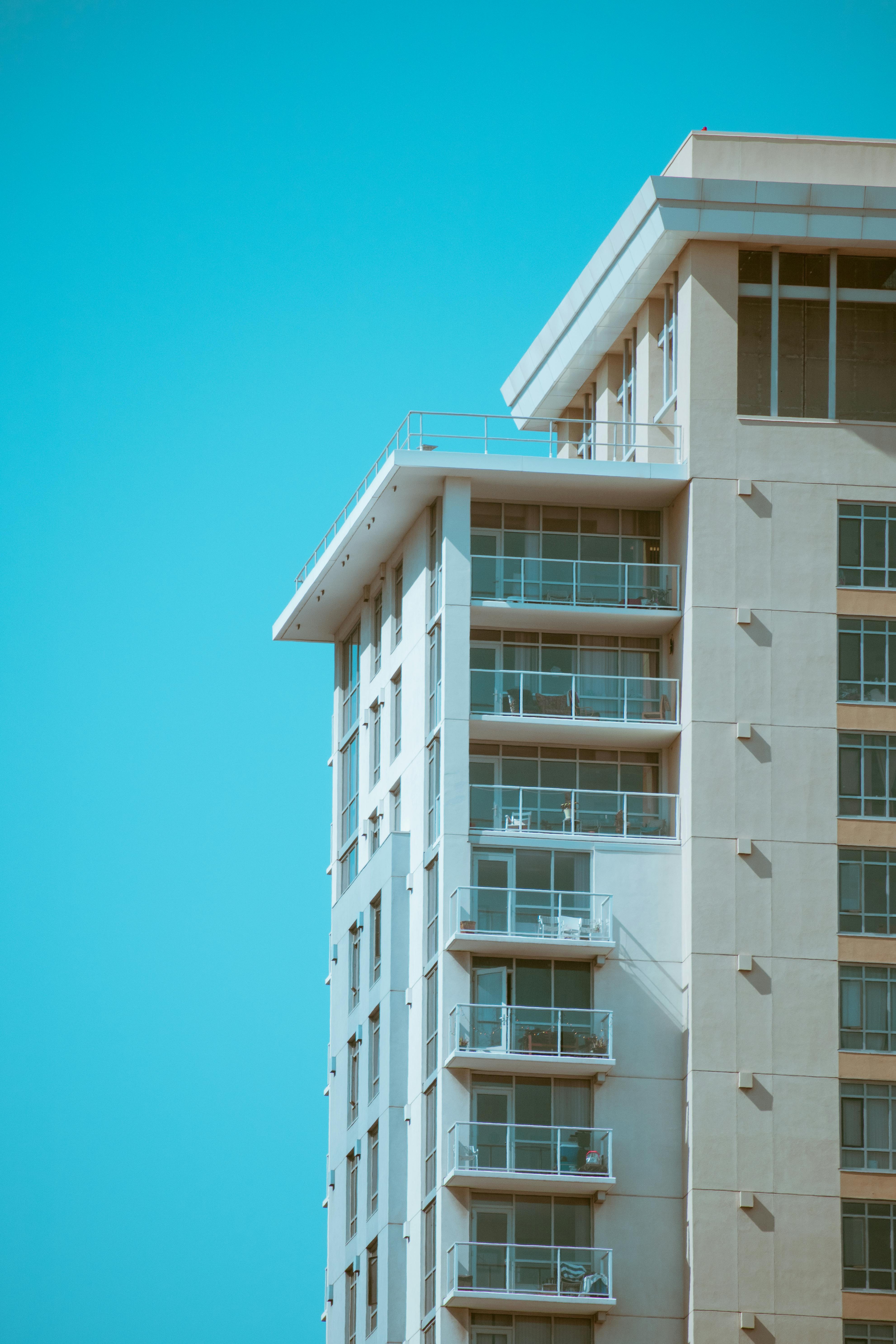 A condominium multifamily building under blue sky