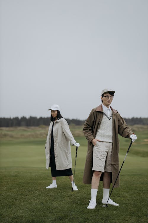 Free Man and Woman on Golf Course Stock Photo