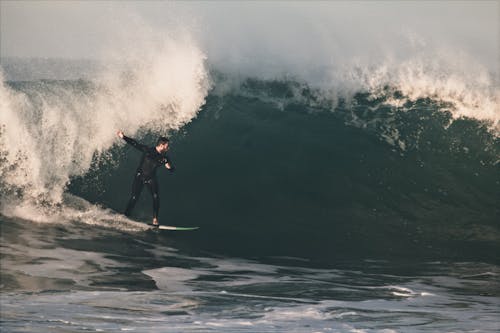 Man Surfing on Ocean Waves