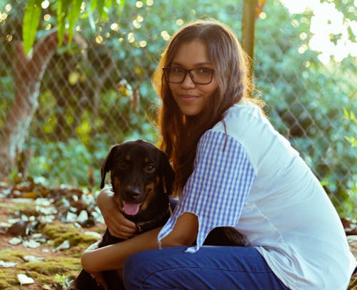 Woman Hugging Her Dog 