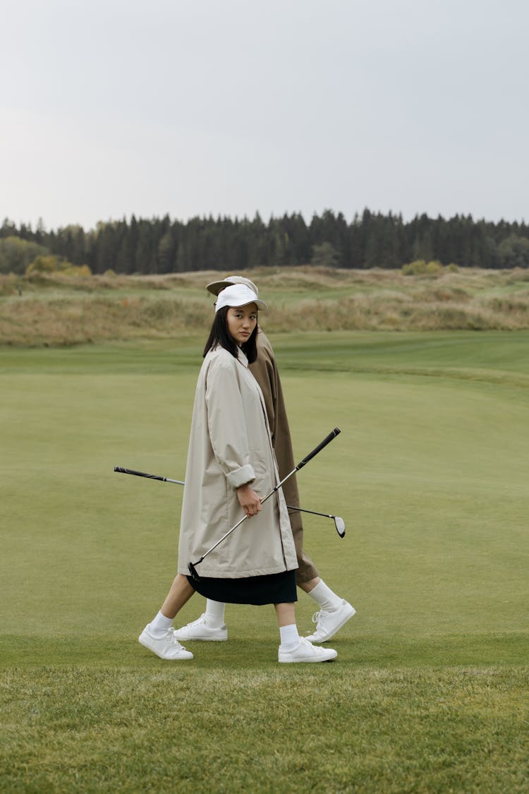 Woman In Coat In Golf Course