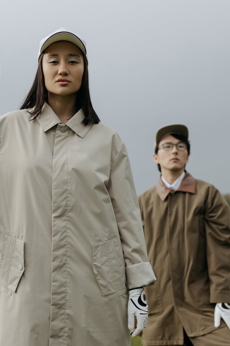 Woman In Brown Coat Standing Beside Man In Brown Coat