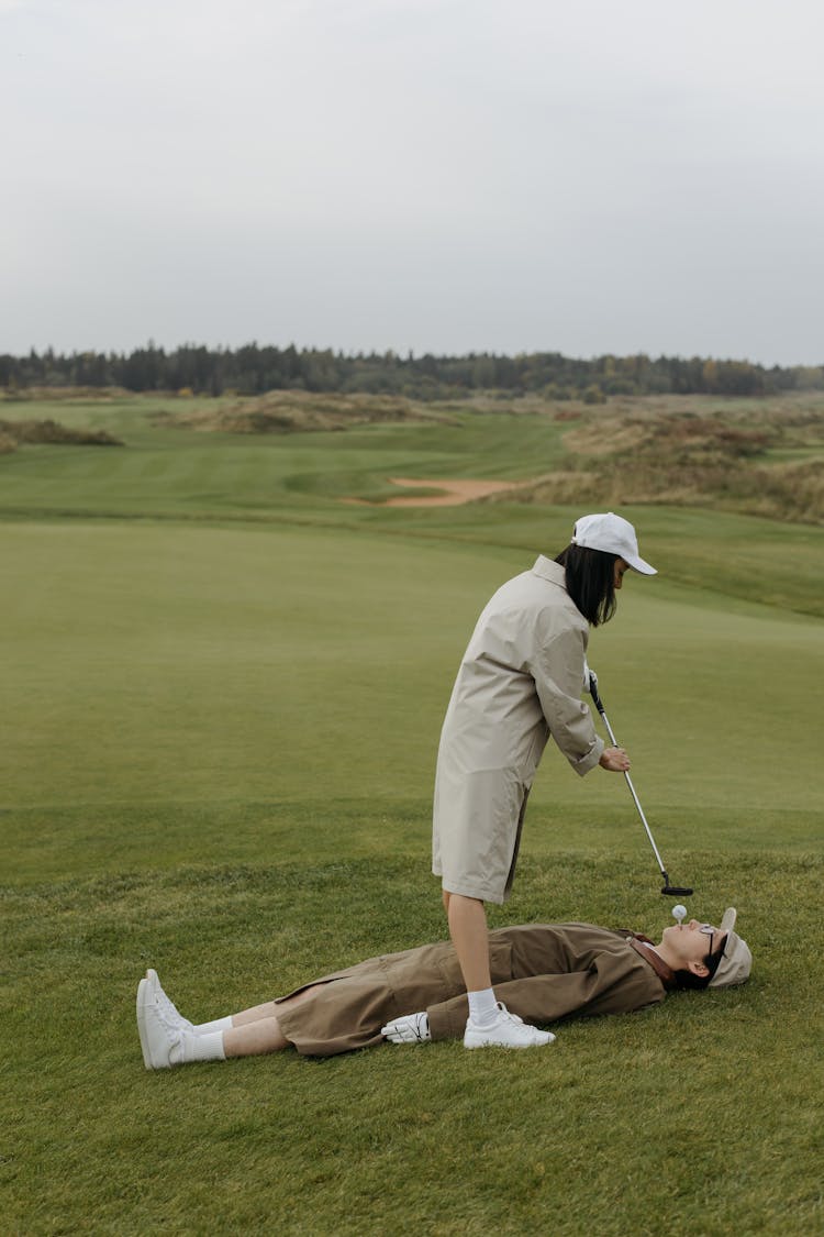 Man And Woman Playing Golf