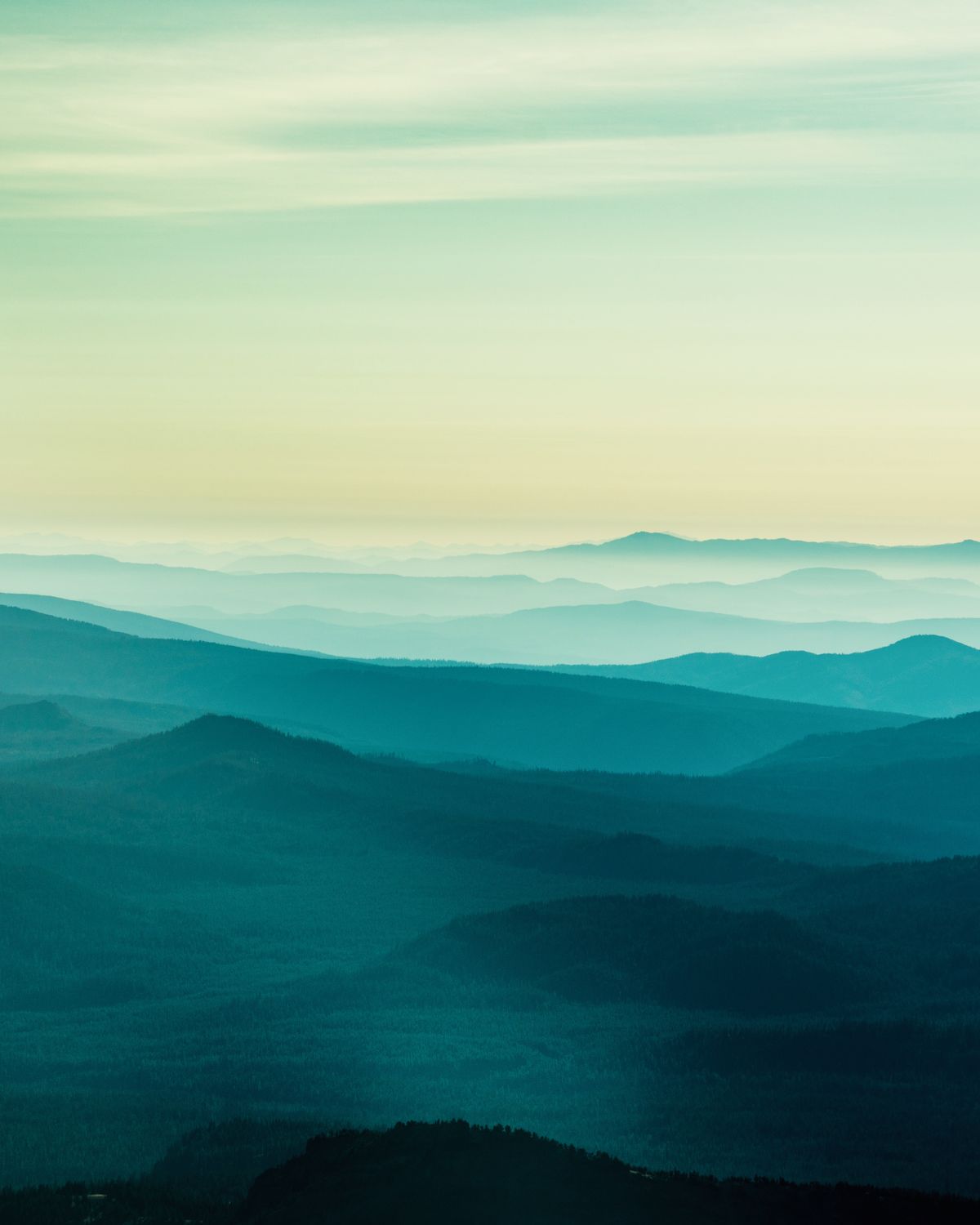 Misty mountain ridgelines at dawn — photo by Felipe Alves on Pexels