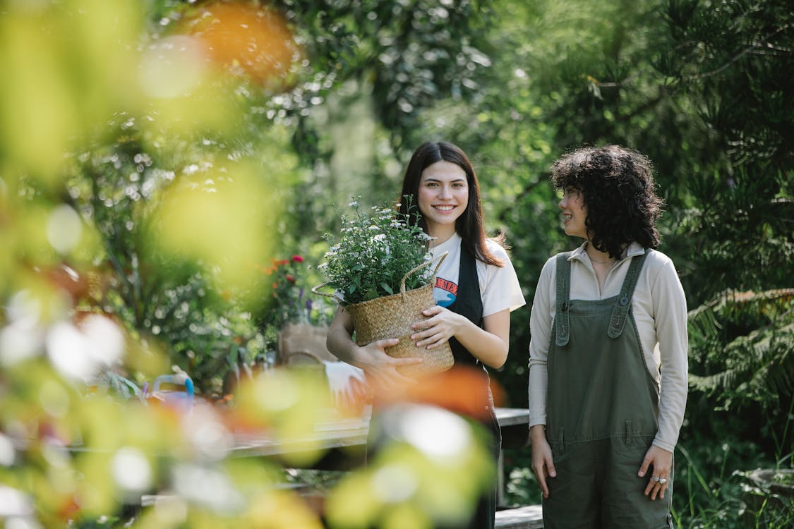 Cheerful women spending time in garden · Free Stock Photo