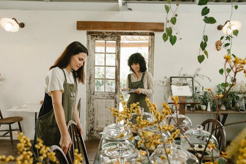 Young women working in small shop