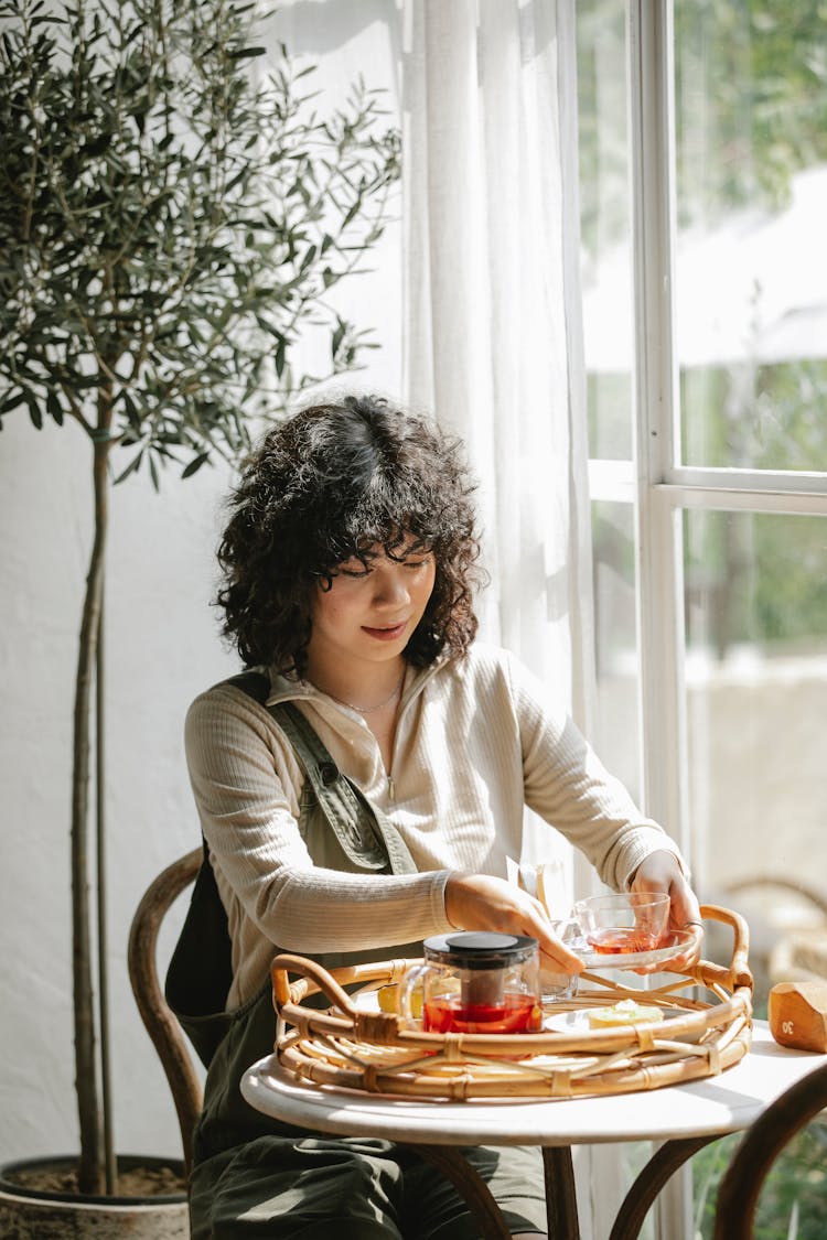 Focused Customer With Tea In Cafe