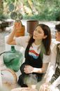 Young women sitting close and talking in terrace
