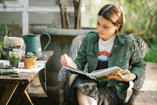 Gardener reading book in armchair near plants in pots with the Quote "An organization's ability to learn, and translate that learning into action rapidly, is the ultimate competitive advantage." written on it and have average color value #7A7A68