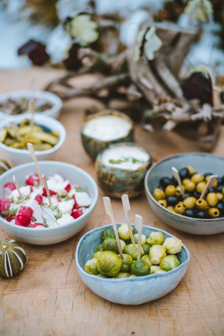 Bowls Of Food On Wooden Table