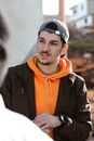 Man in Black and Orange Zip Up Jacket