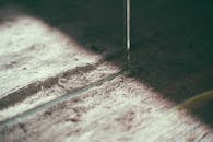 Cutting of soft thick fabric in sunlight