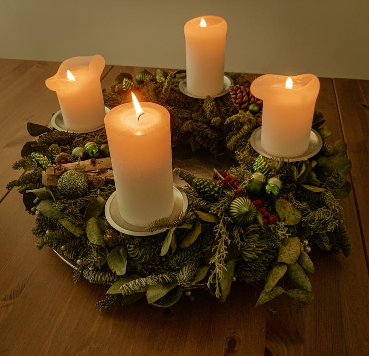 Burning Candles On Creative Wreath Holder