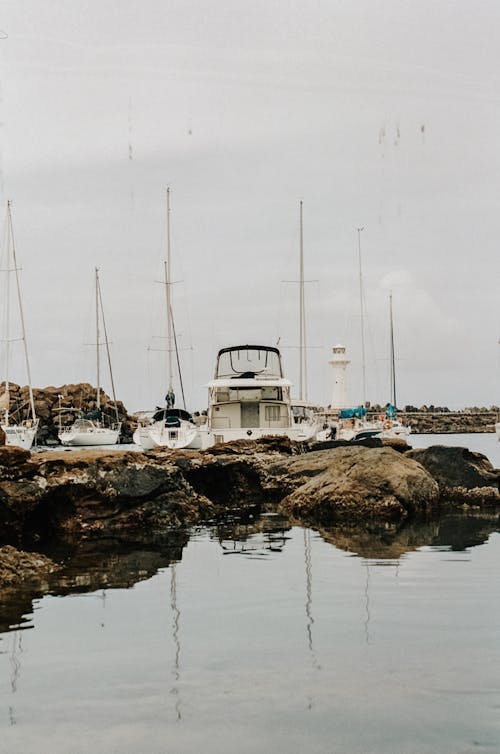 Yachts Moored near Rocks