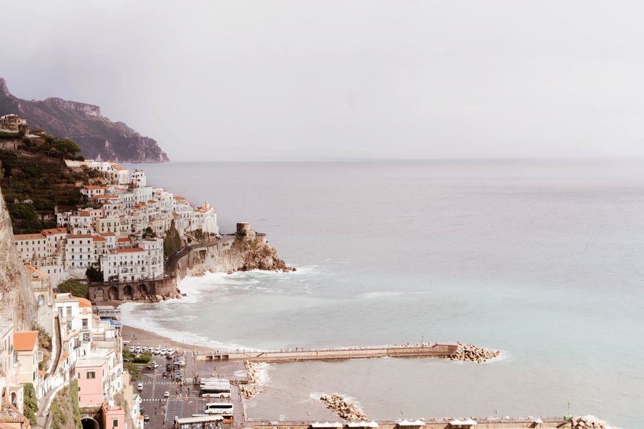 A breathtaking aerial perspective of the Amalfi coastline showcasing cliffs, the sea, and charming architecture.