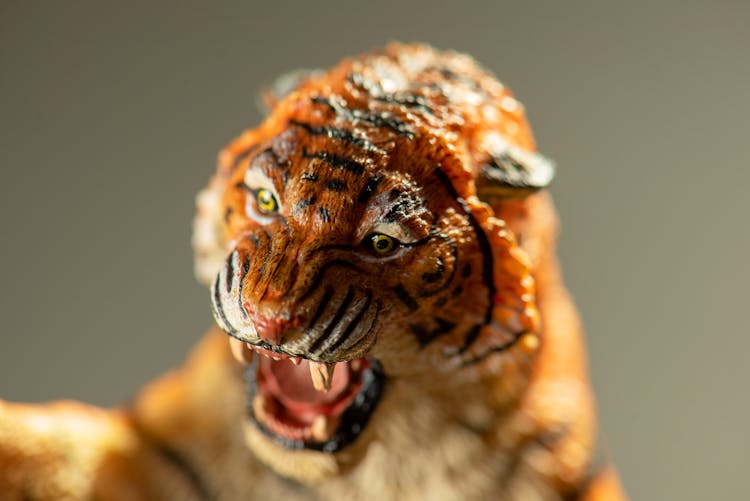 Tiger Figurine In Close Up Photography