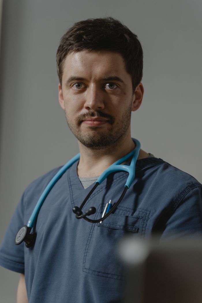 Paramedic ready to deliver CPR and AED care