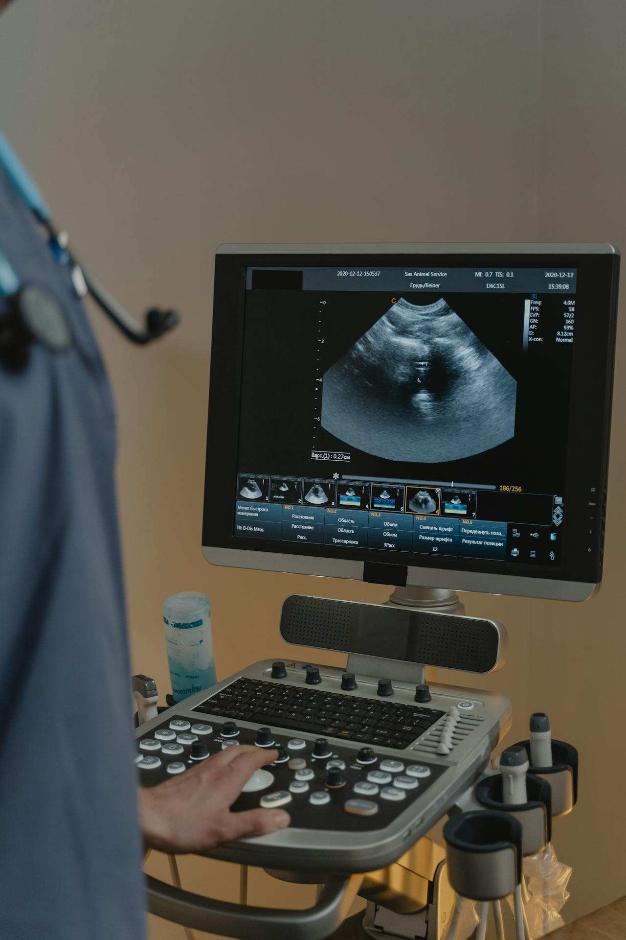 Healthcare professional cleaning a wound on a patient's arm