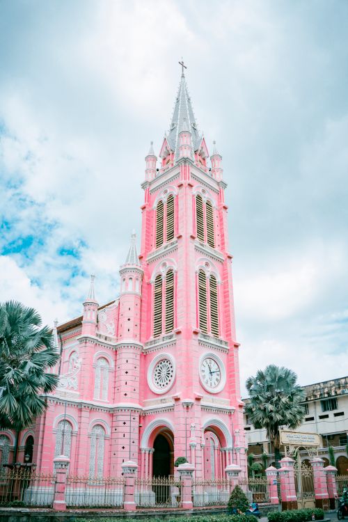 Free Vertical shot of the iconic Tan Dinh Church's pink facade in Ho Chi Minh City. Stock Photo