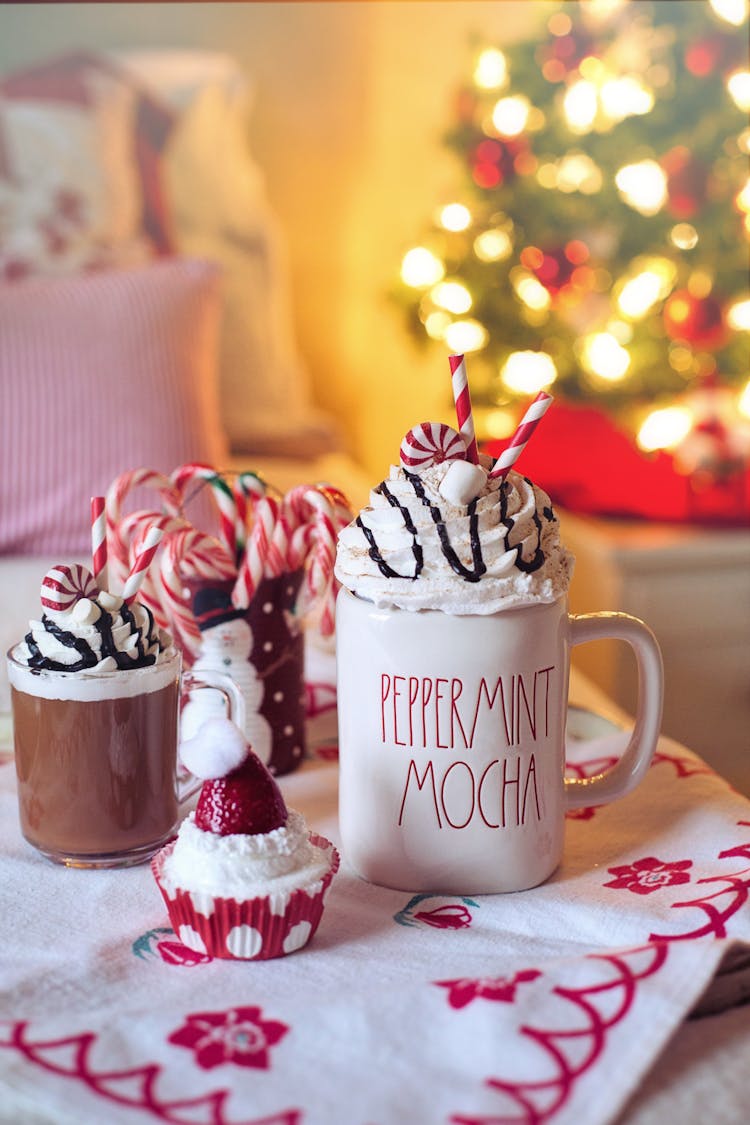 A Close-Up Shot Of Hot Beverages And A Cupcake