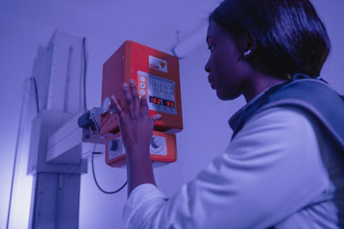 A Woman Operating a Machine