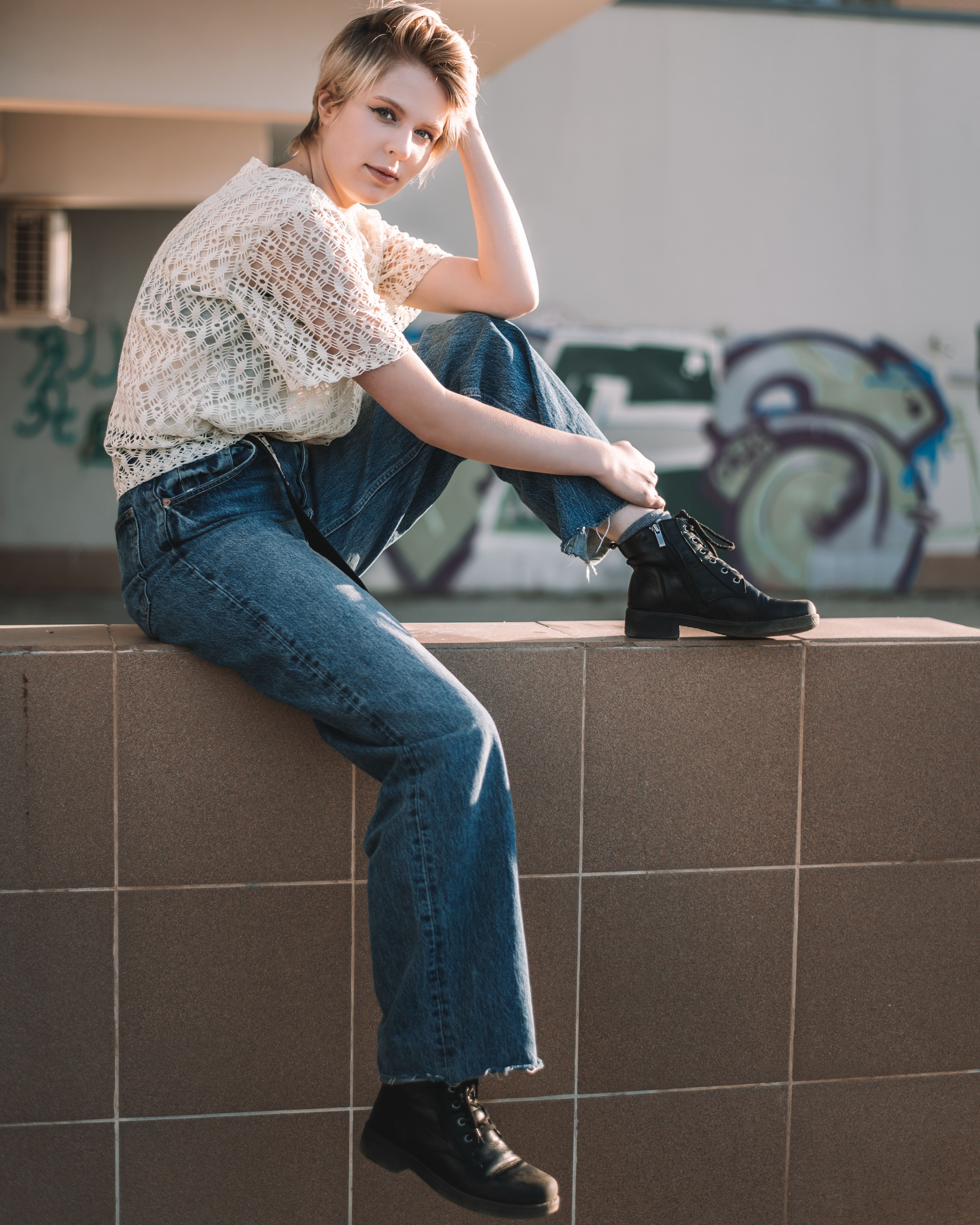Woman in Blue Denim Jeans and Black Leather Shoes · Free Stock Photo