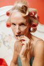 A Woman Eating a Gingerbread Cookie