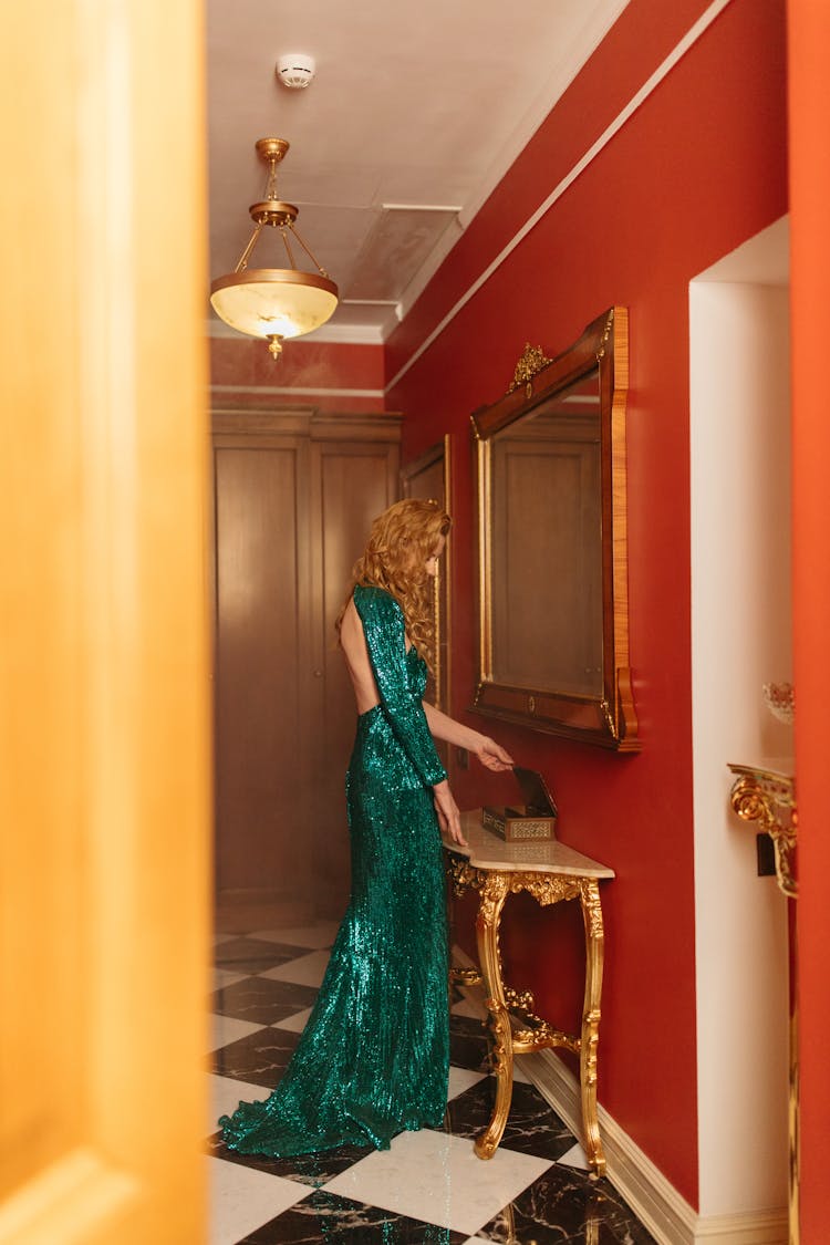 Elegant Woman In Shimmering Green Dress