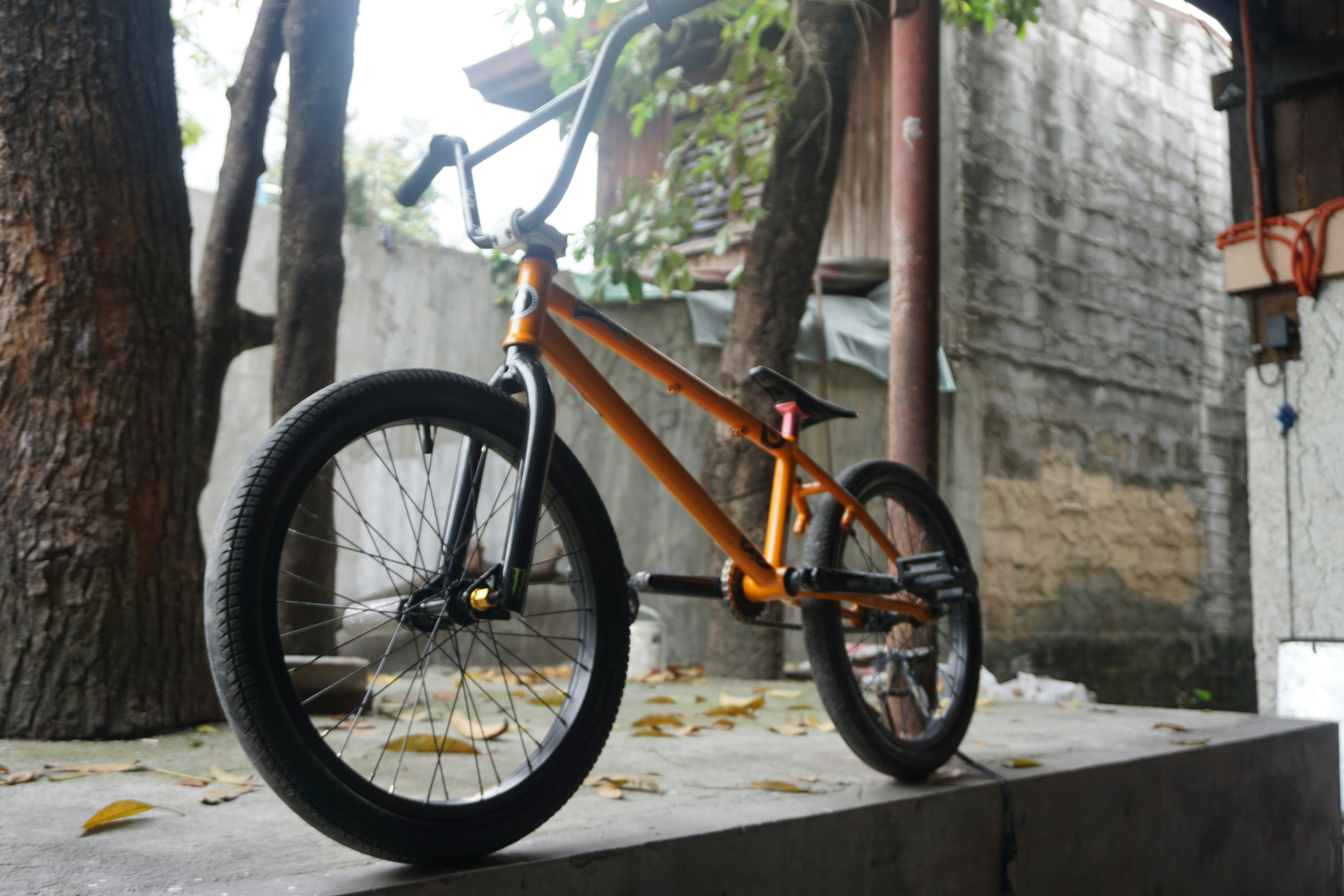 orange and black bmx bike